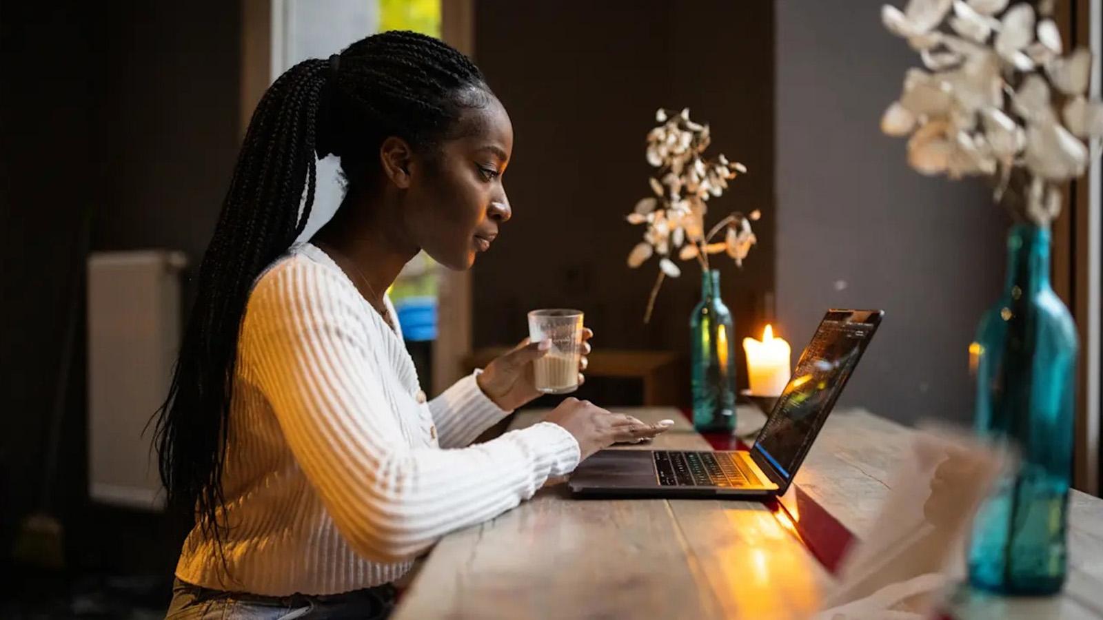 Woman using her laptop and focusing on work