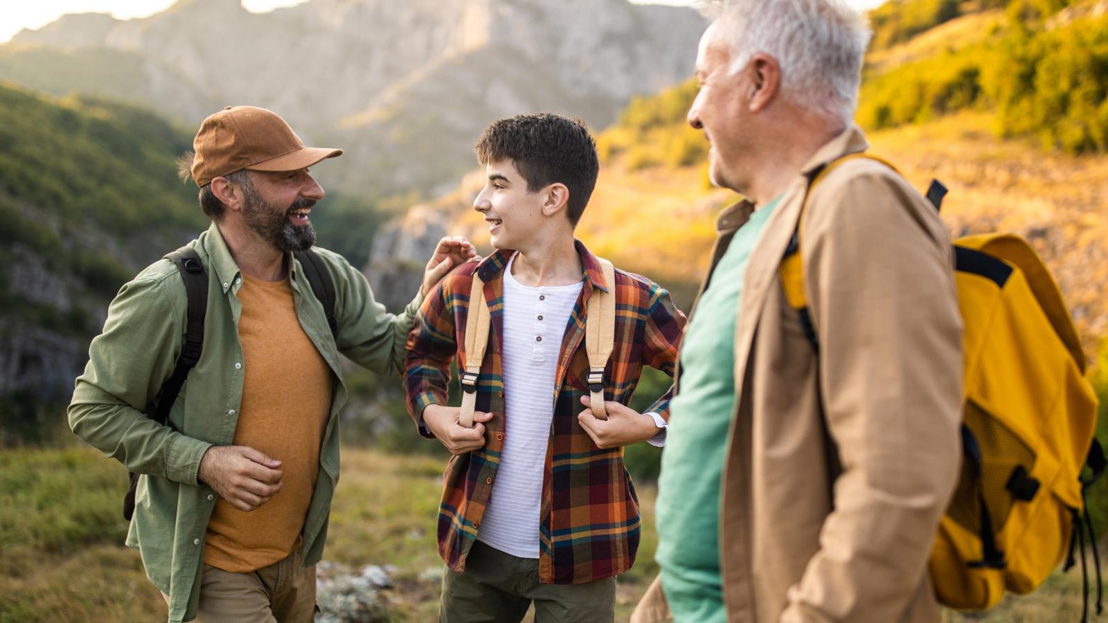 Family with backpacks hiking