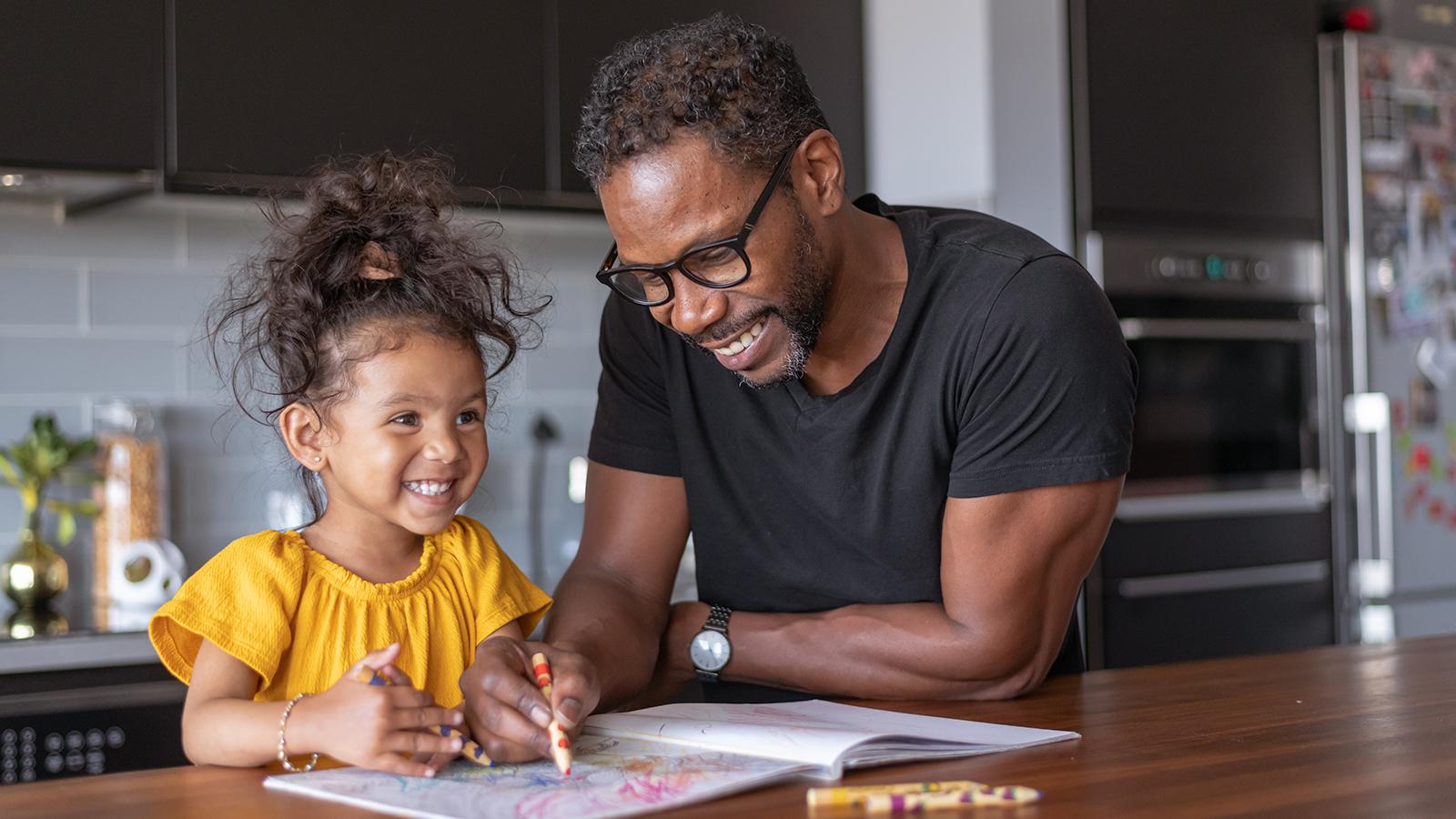 father-coloring-with-his-daughter-at-home.jpg