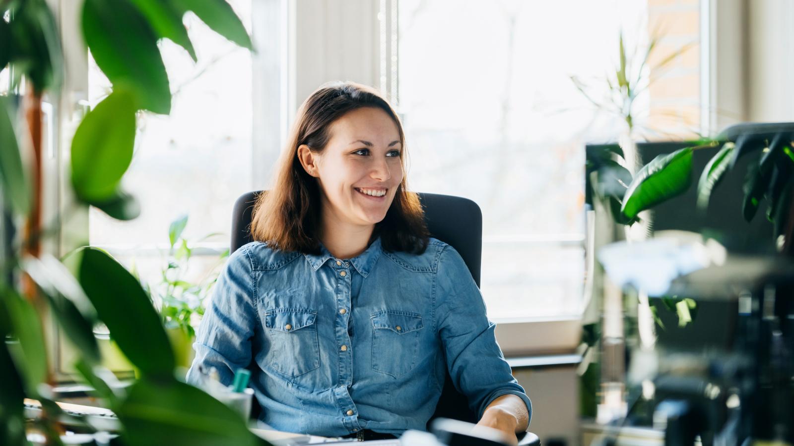 Woman working at desk in modern office