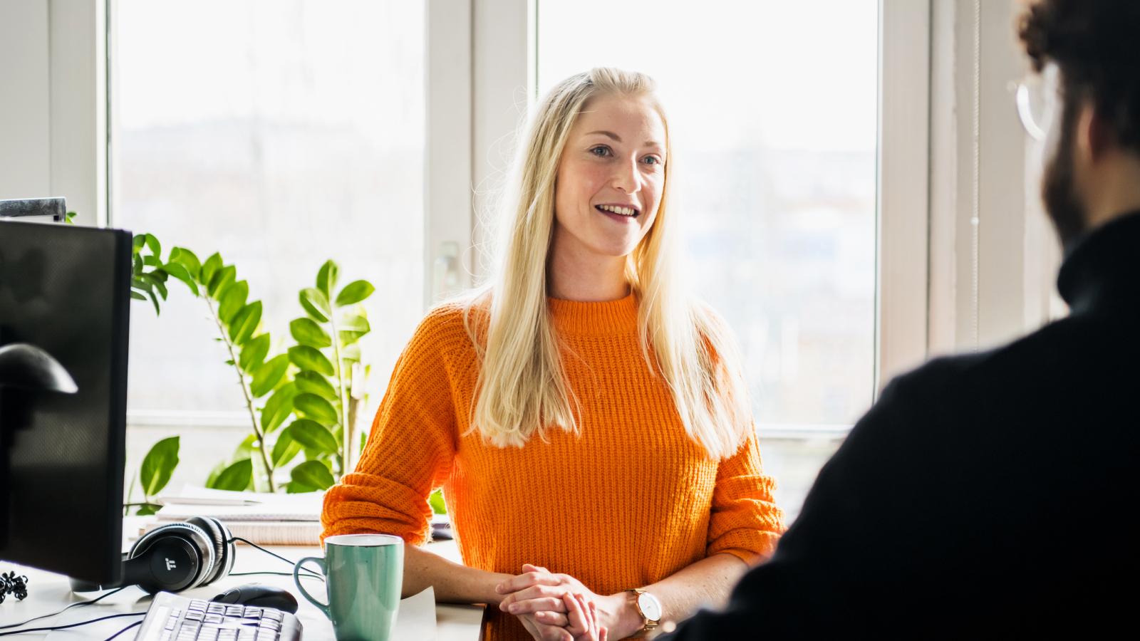 Woman discussing work with colleague