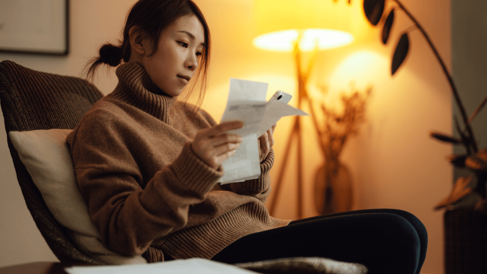 Woman reading bills