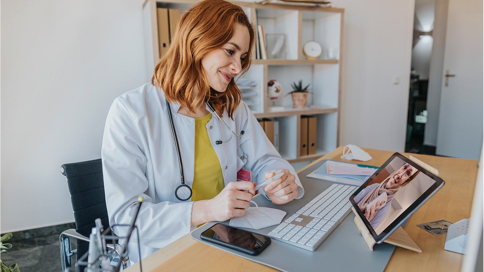 Doctor speaking to her patient virtually Doctor speaking to her patient virtually