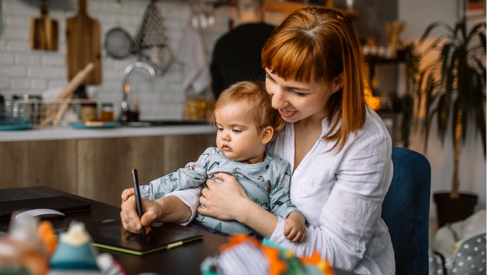 Woman holding baby on lap