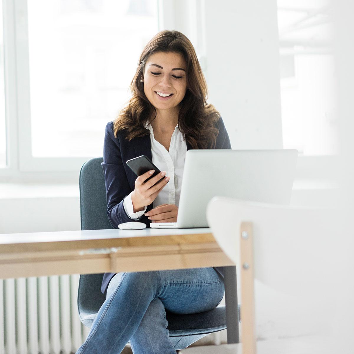 Woman on her computer in a video chat with her dentist.
