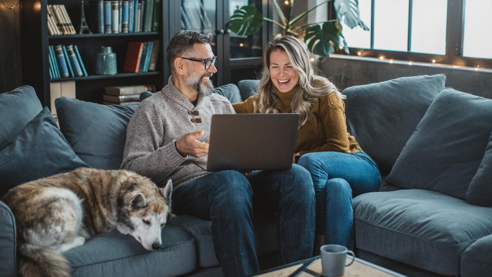 Couple at home on video call with friends