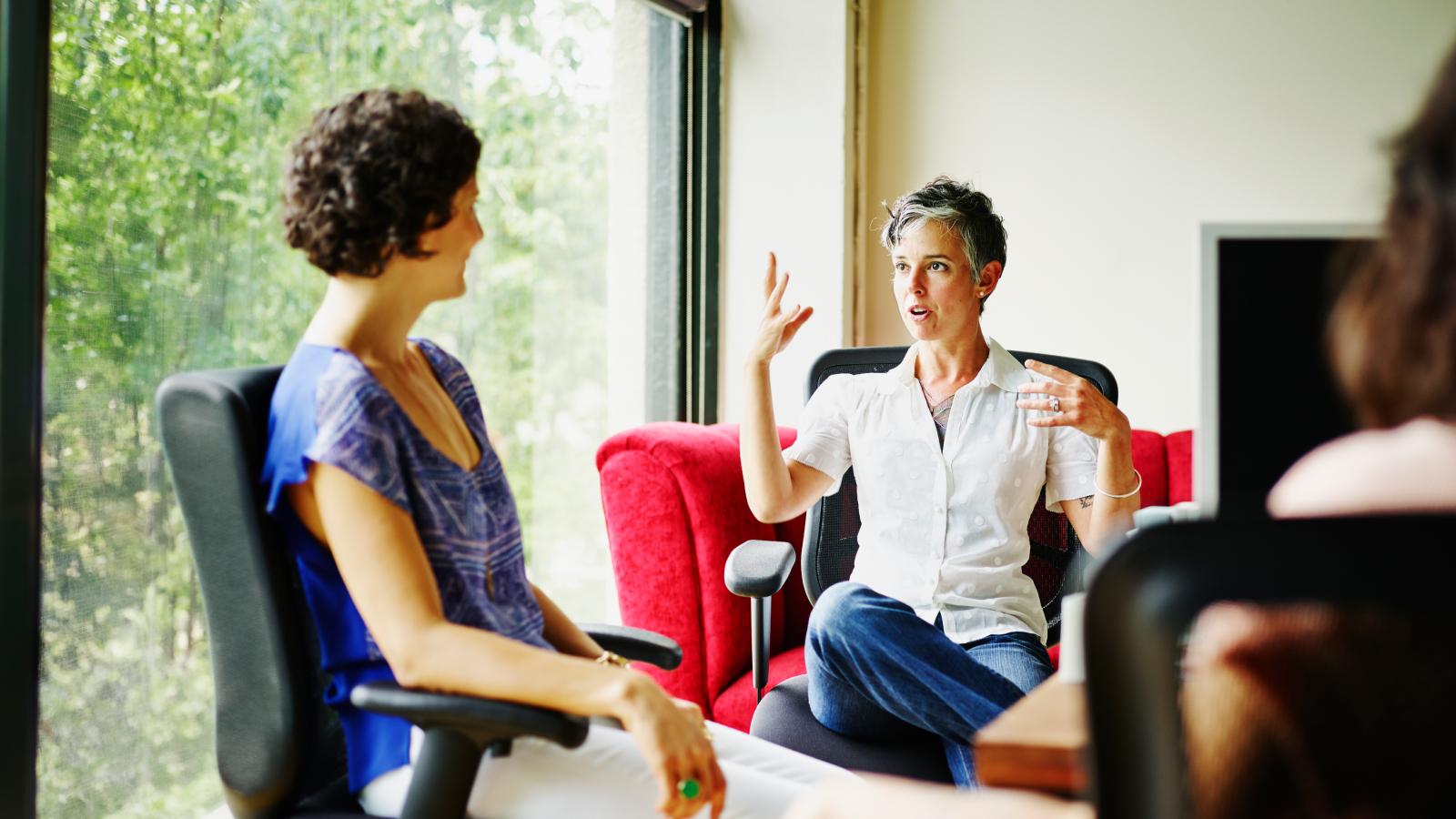 Businesswoman leading meeting in office