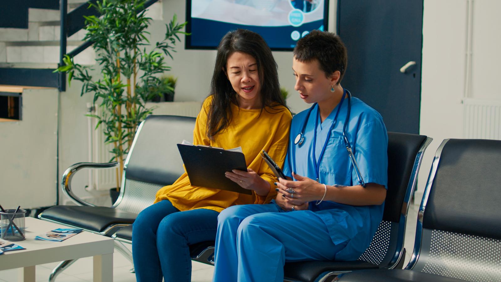 Woman consulting with a nurse. Woman consulting with a nurse.