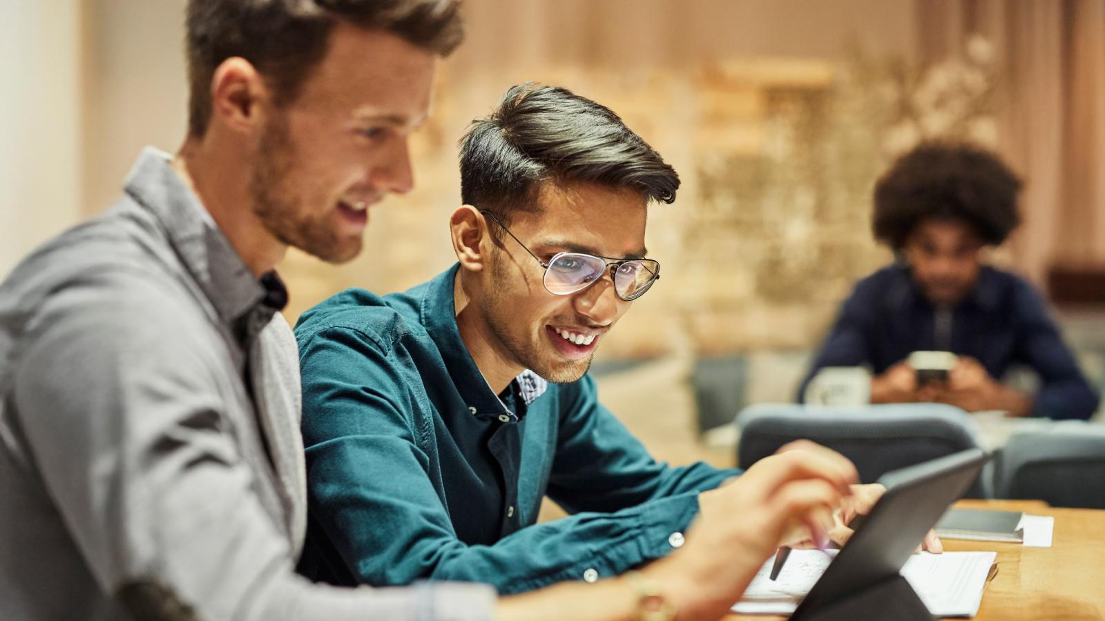 male coworkers working in creative office
