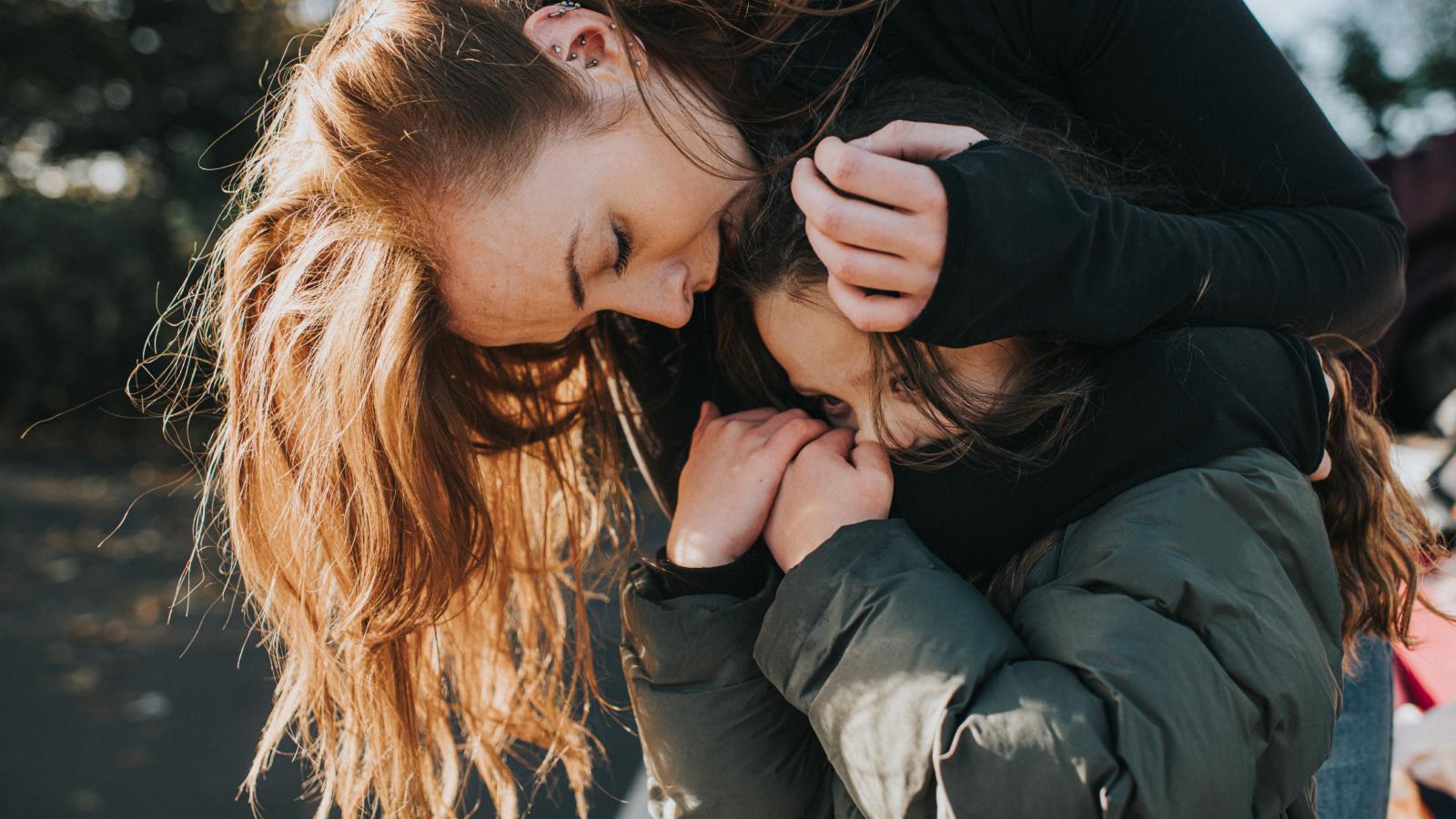 Mother comforting her daughter