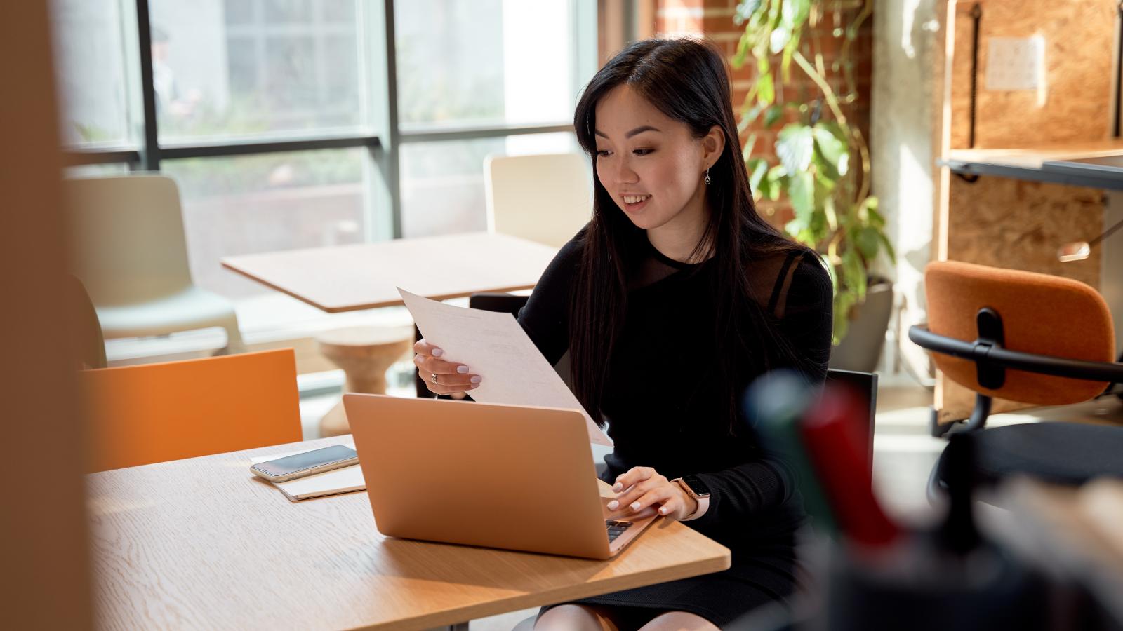 Woman sitting in modern office
