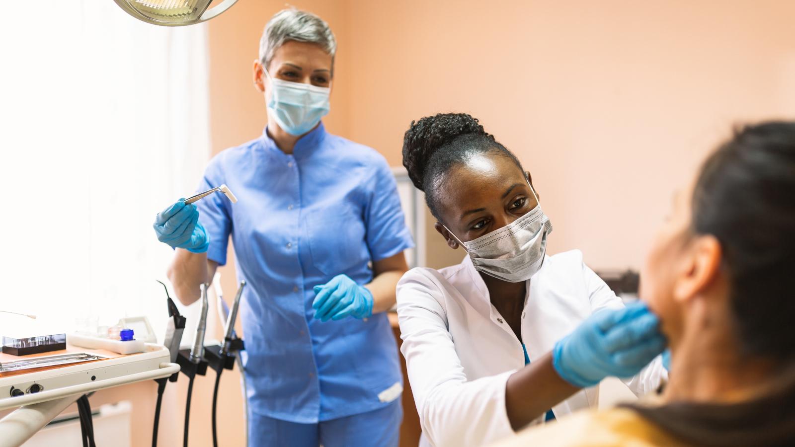 Nurse helping dentist