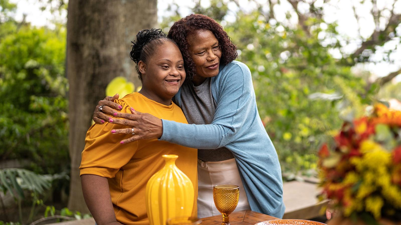 Loving mother embraces daughter Loving mother embraces daughter