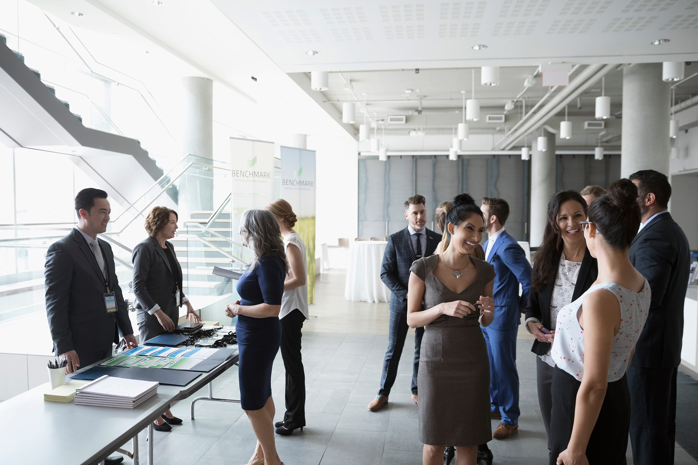 Employees networking with other companies at an event.