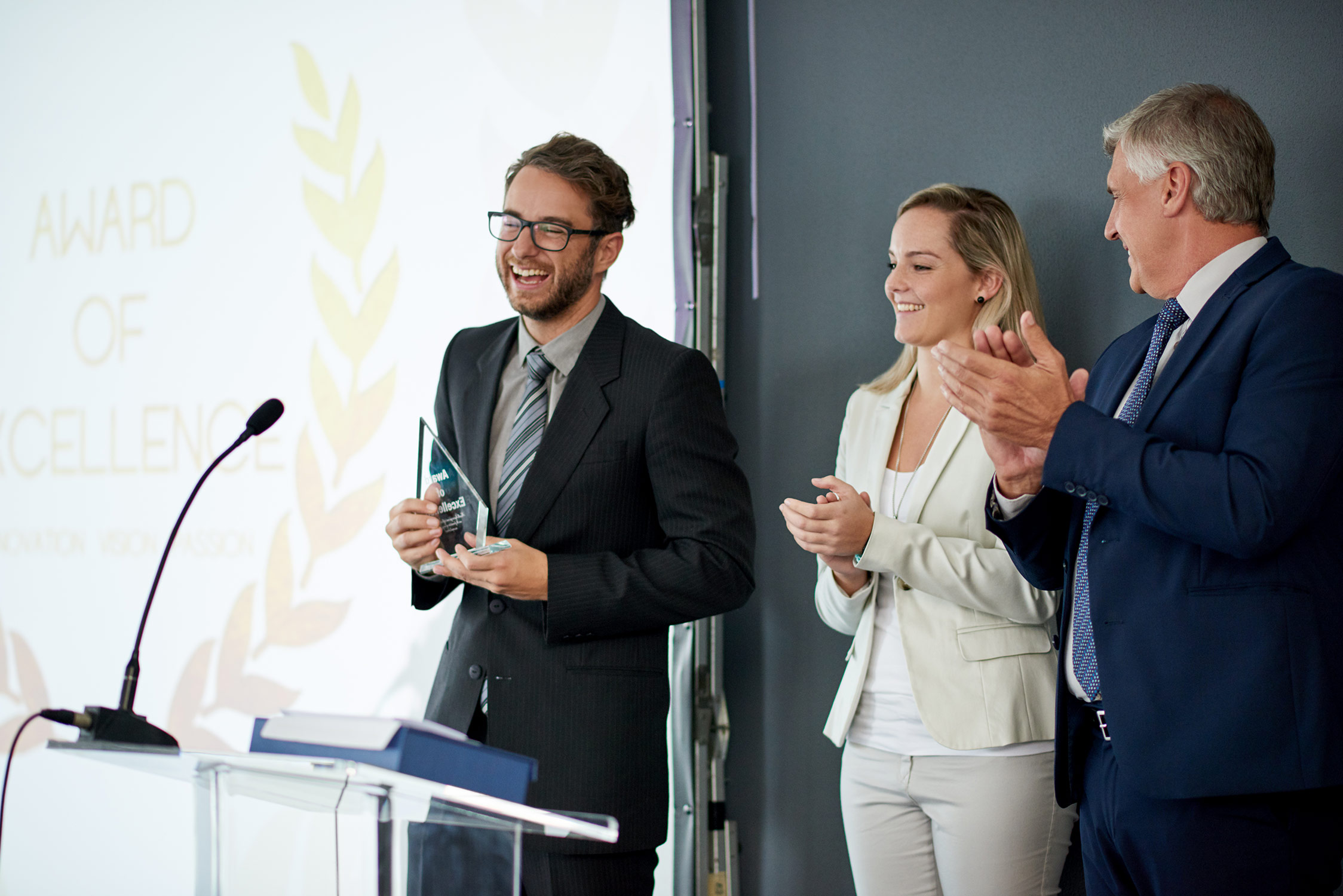 Male employee accepting an award